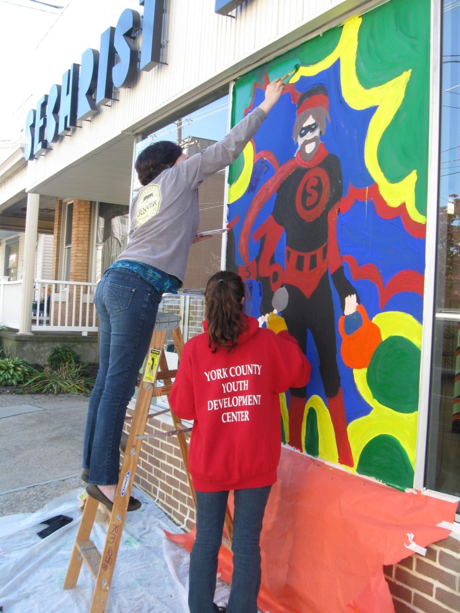 Art students painting their Halloween murals on local Dallastown businesses.