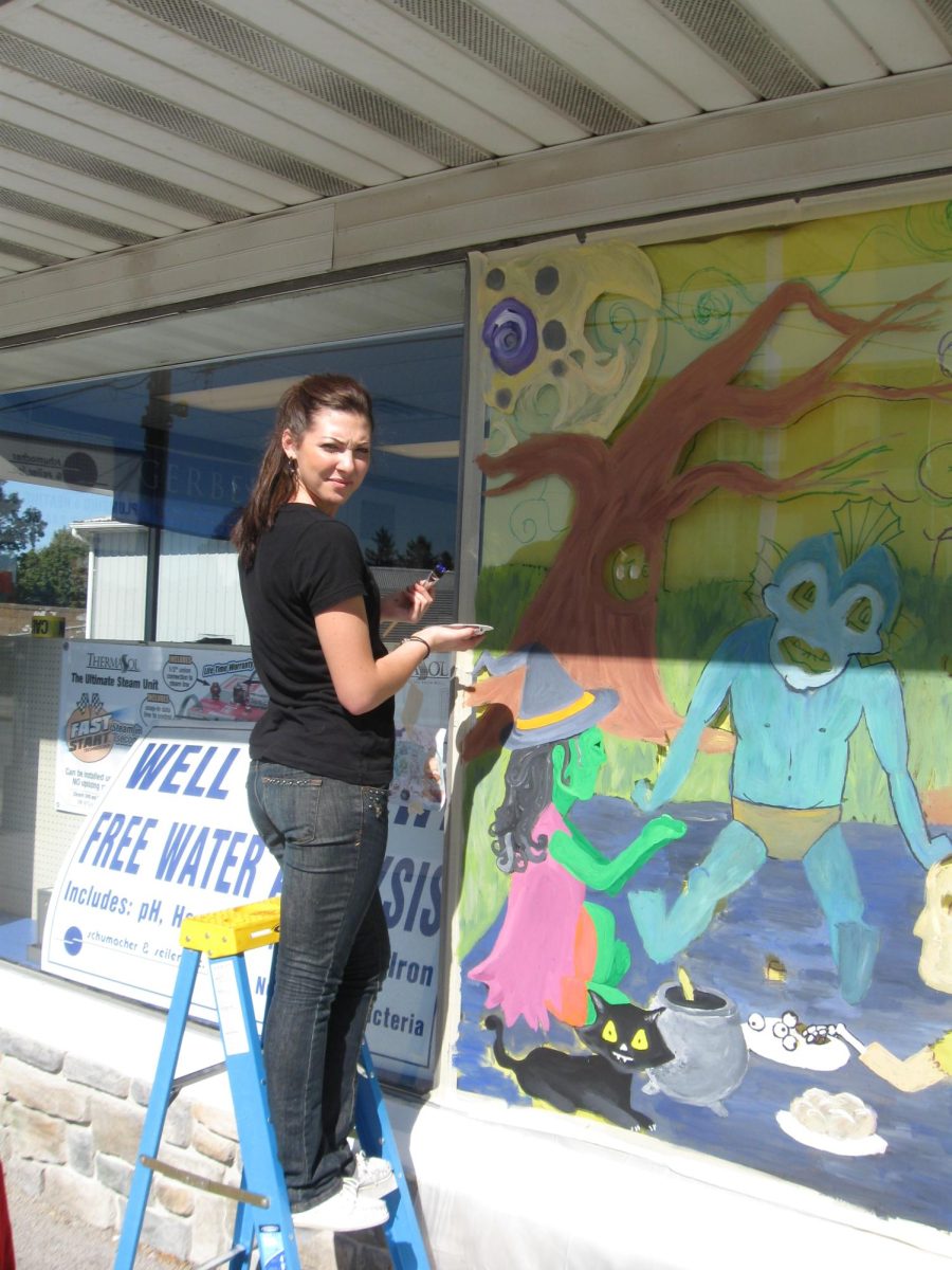 Art students painting their Halloween murals on local Dallastown businesses.