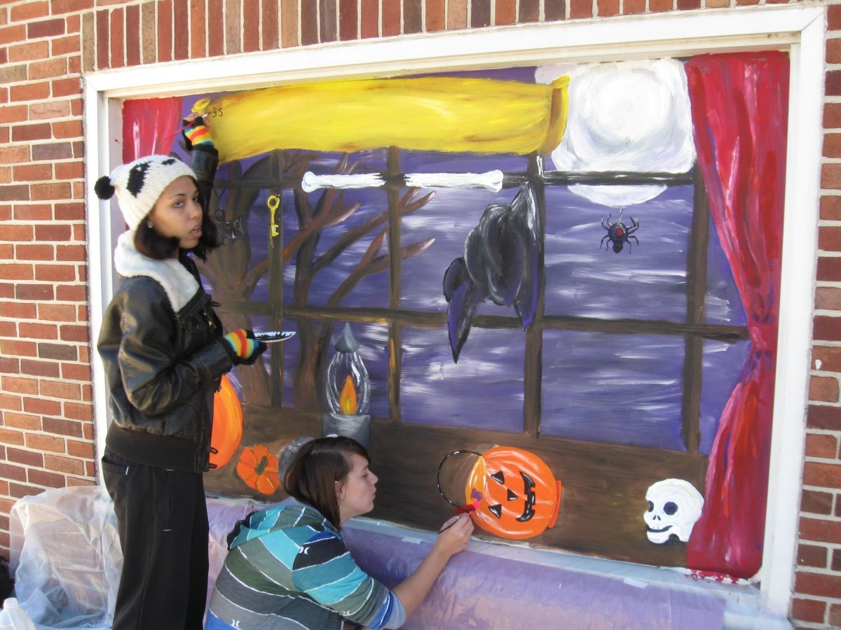 Art students painting their Halloween murals on local Dallastown businesses.