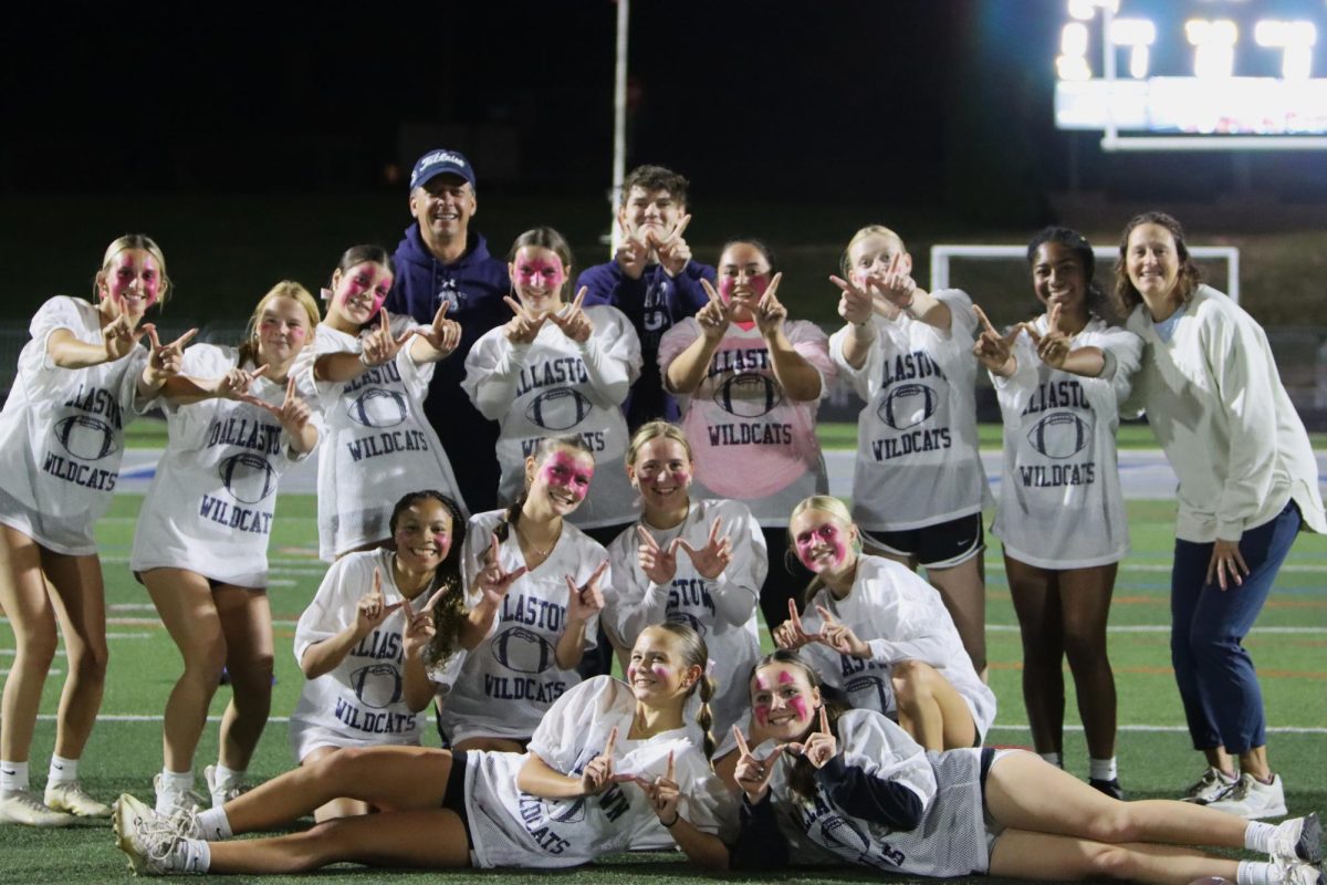 Underclassman girls posing for a picture after wining Powder Puff.