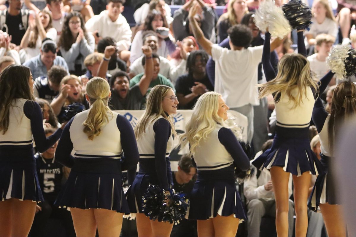 Students cheering in class sections.