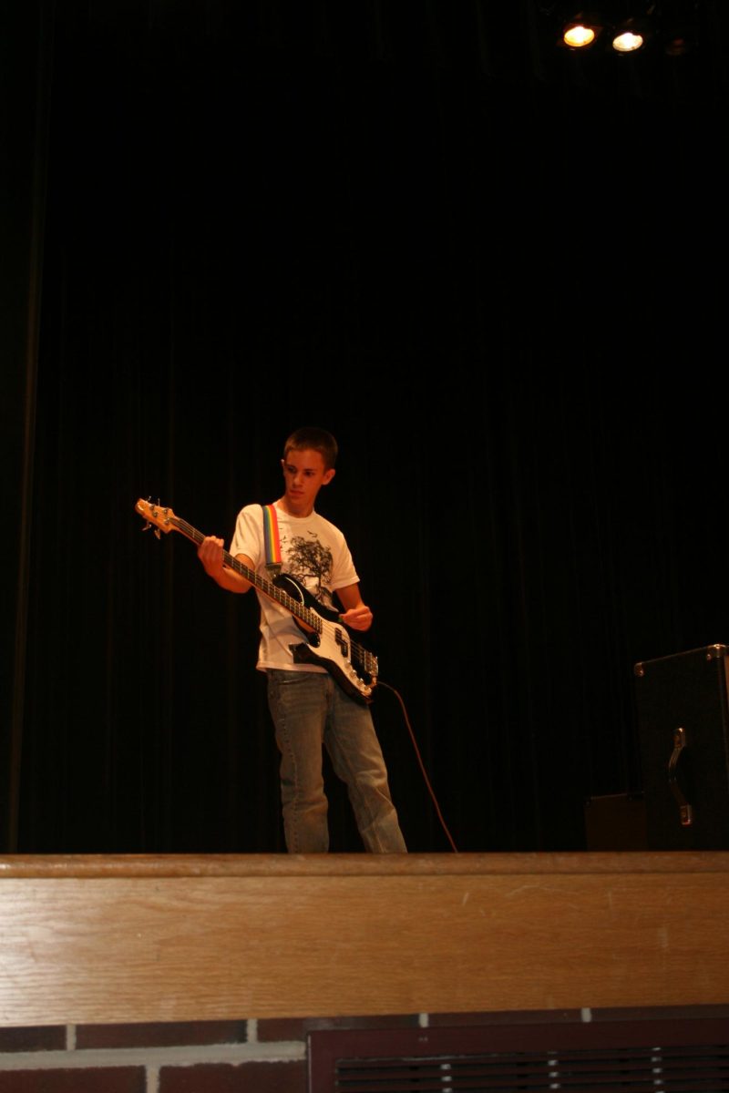 Battle of the Bands contestant playing the guitar