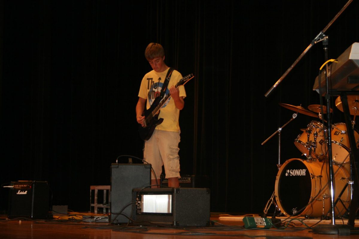 Battle of the Bands contestant playing the guitar