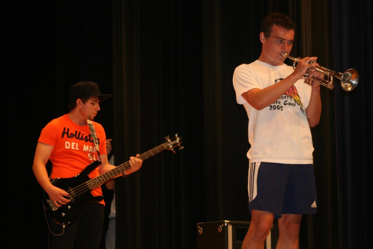 Battle of the Bands contestants playing instruments.