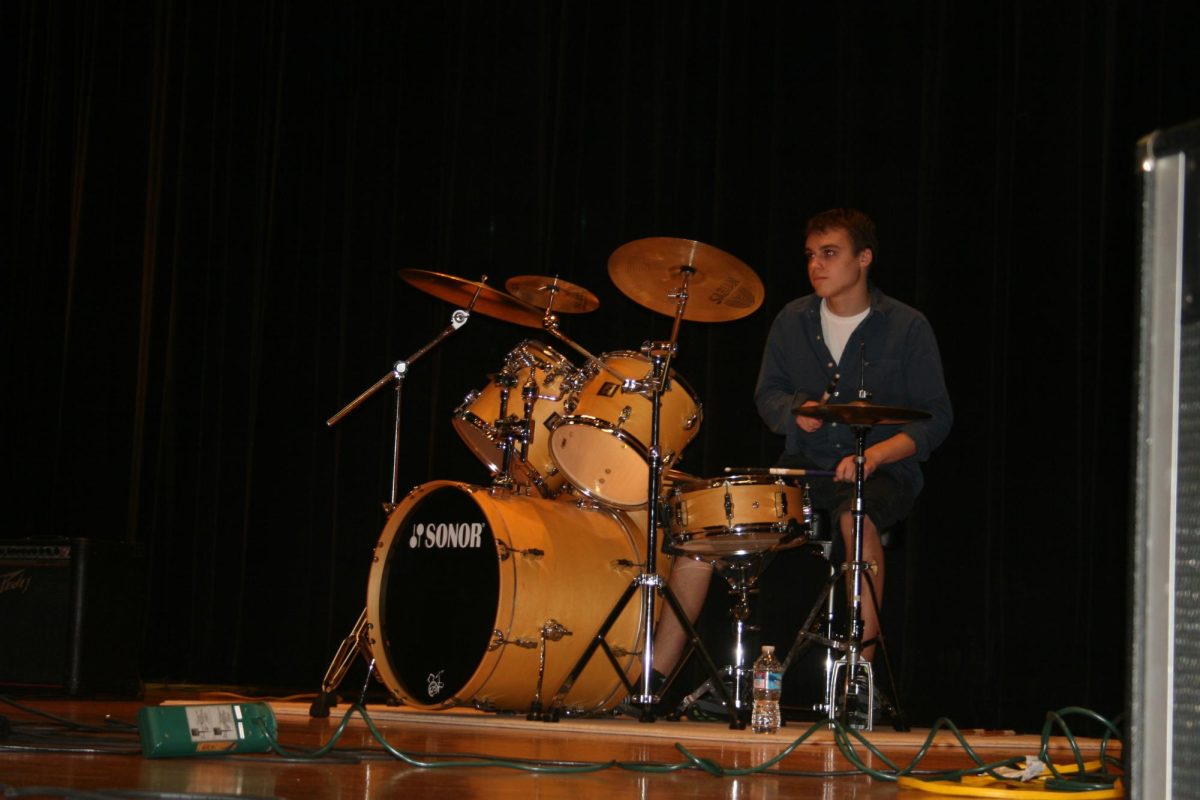 Battle of the Bands contestant playing the drums.