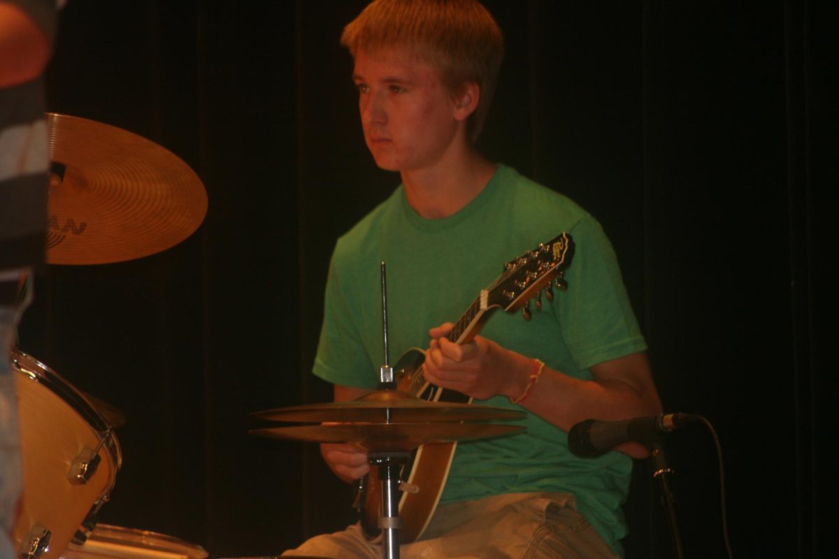 Battle of the Bands contestant playing the guitar