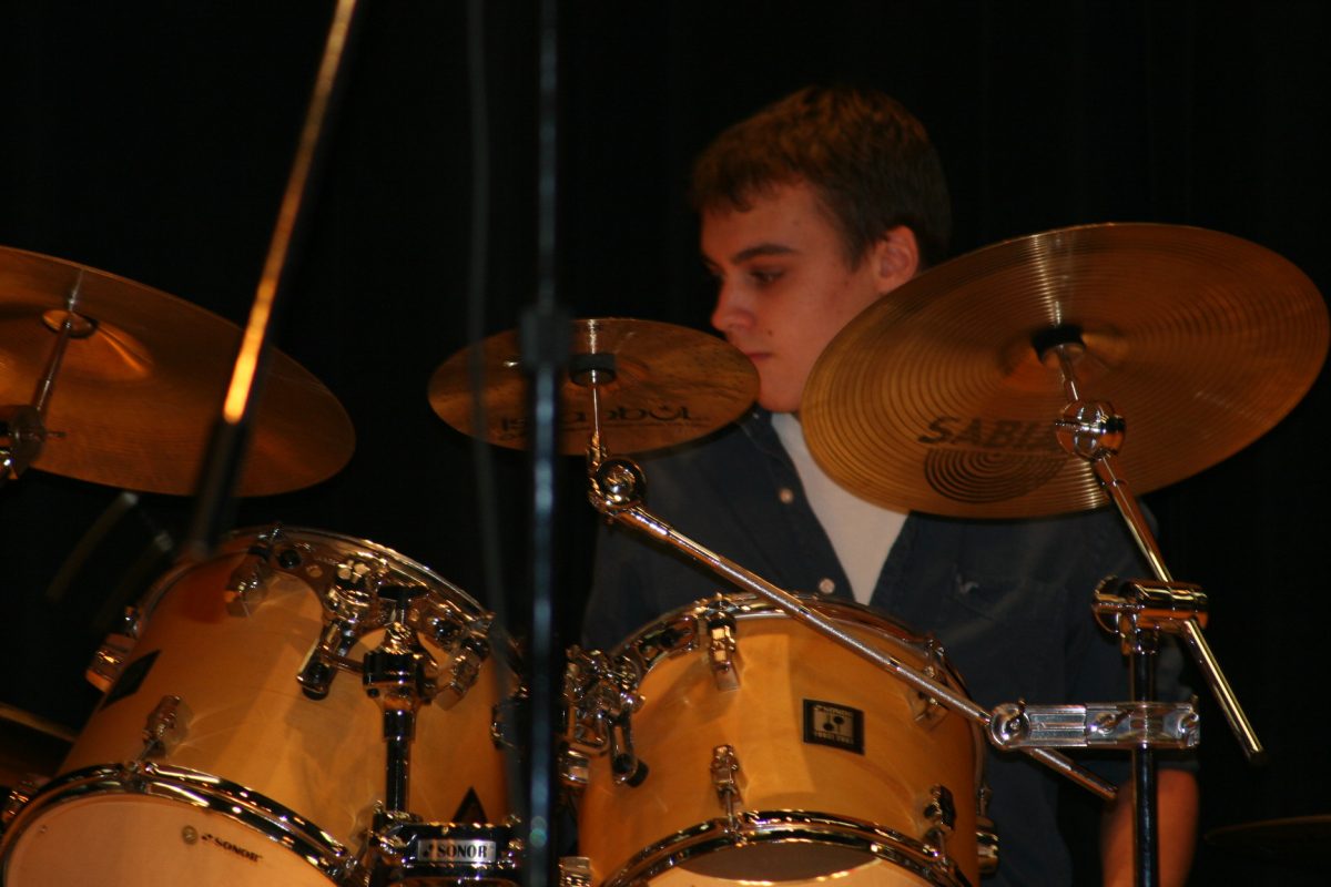 Battle of the Bands contestant playing the drums.