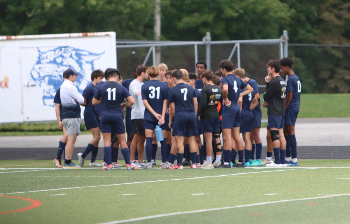 The Dallastown varsity boys soccer team huddles up during the game agenst Manheim township.