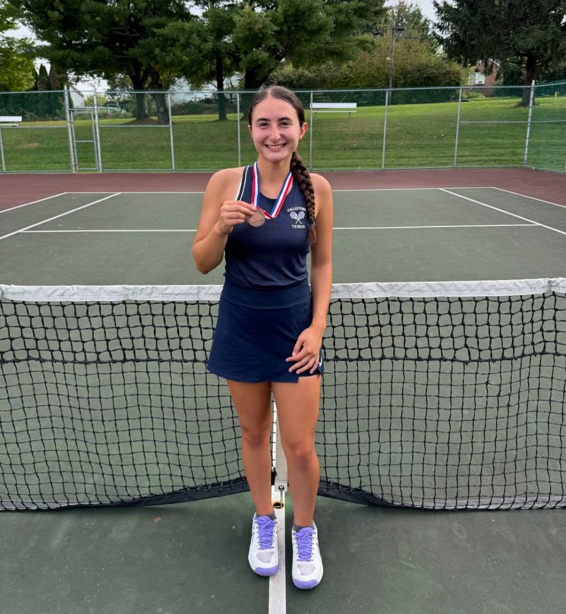 Elizabeth Tony holding her third place medal from counties. (Dallastown girls tennis)