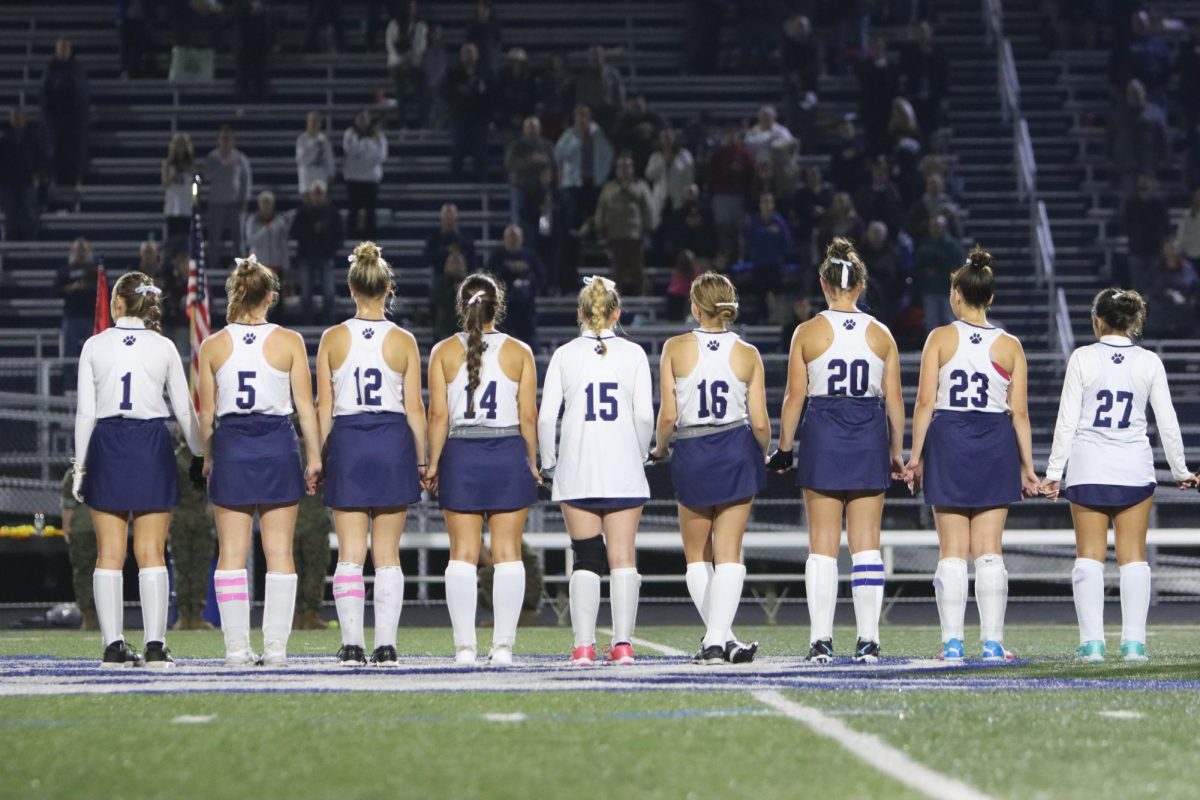 Dallastown varsity feild hockey seniors stand together on senior night.