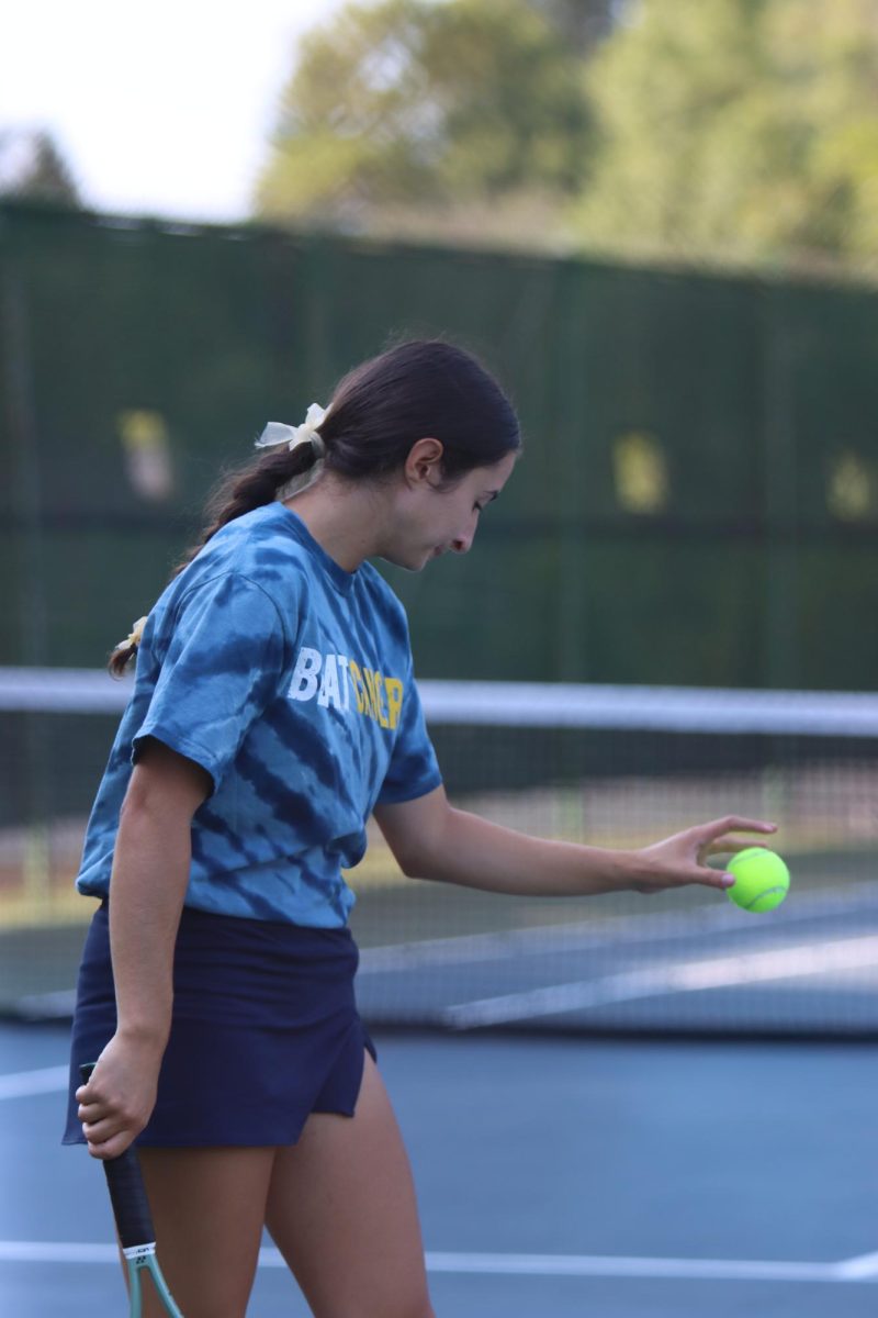 Senior Elizabeth Tony prepares to serve at the tennis match agenst Red Lion high-school. 