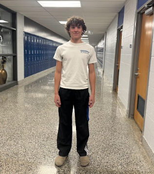 Student is pictured wearing a relaxed outfit in the halls of Dallastown. 