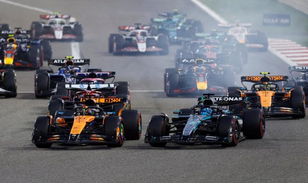 Formula One F1 - Bahrain Grand Prix - Bahrain International Circuit, Sakhir, Bahrain - April 13, 2025 McLaren's Oscar Piastri leads into the first corner at the start of the race ahead of Mercedes' George Russell REUTERS/Rula Rouhana     TPX IMAGES OF THE DAY