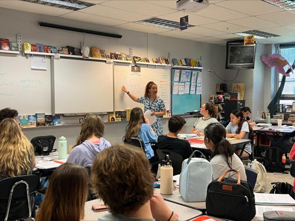 Standing in the front of the class, Bethany Yuninger teaches her Honors English II students. 