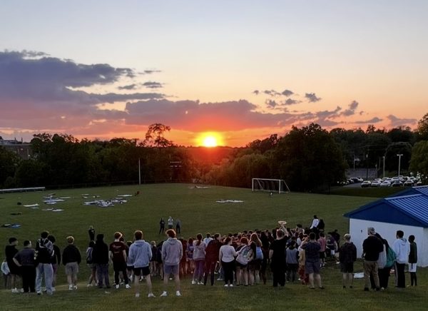 The Class of 2024 watching the sun set of their last moments of high school. 