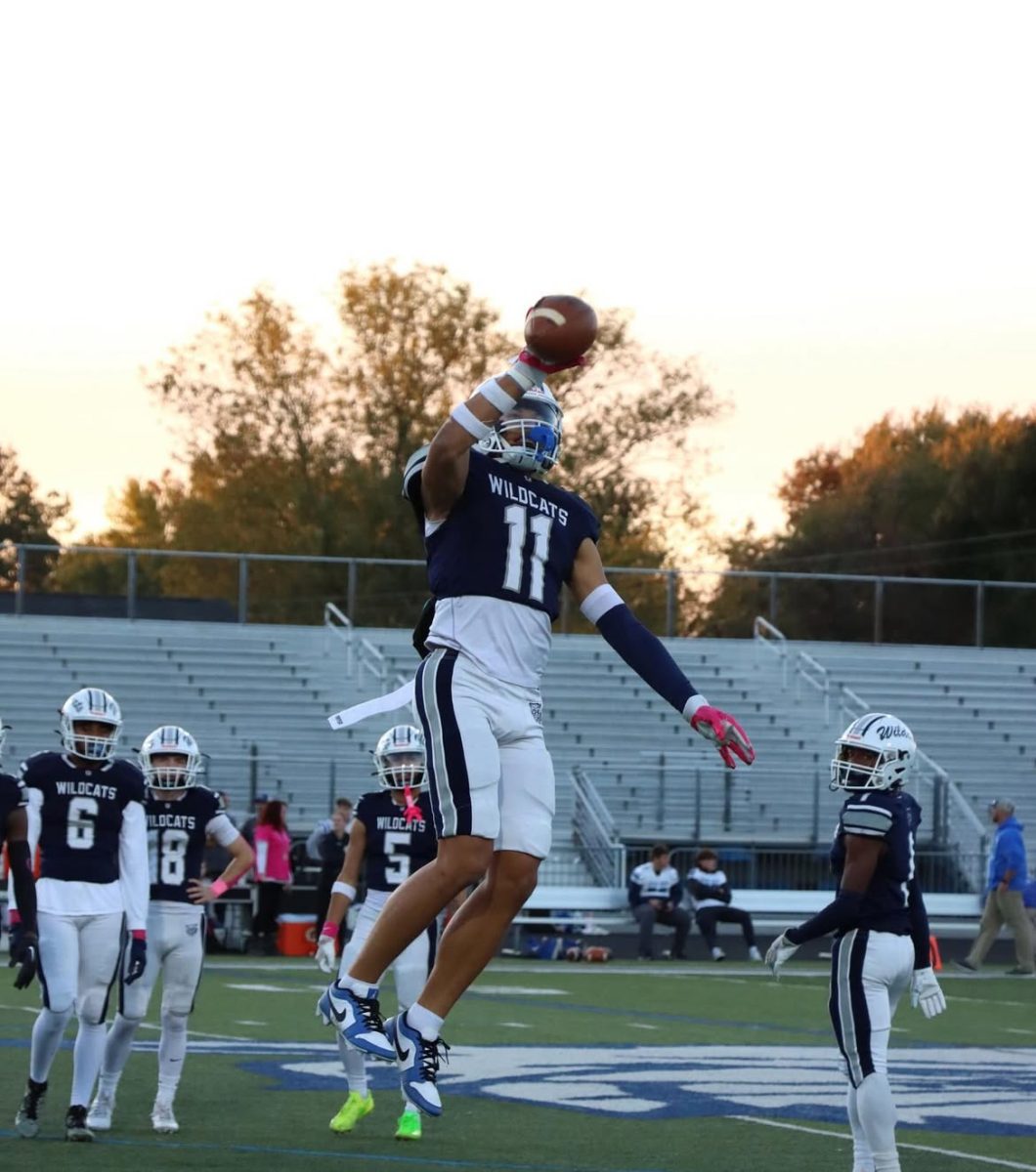 Jalen Cook catches a football during pregame warm up against Spring Grove at Dallastown High School. 