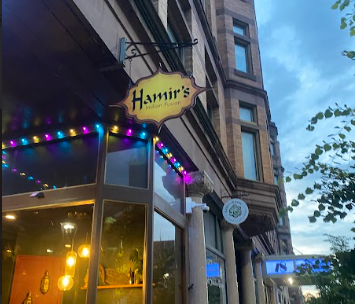 A sign reading "Hamir's Indian Fusion" outside of the restaurant.