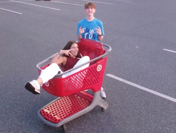 Sophomore Jane Shearer and Red Lion student Landon Knepp having fun in the Target parking lot. Knepp pushes Shearer around in the cart on their weekend adventure. 