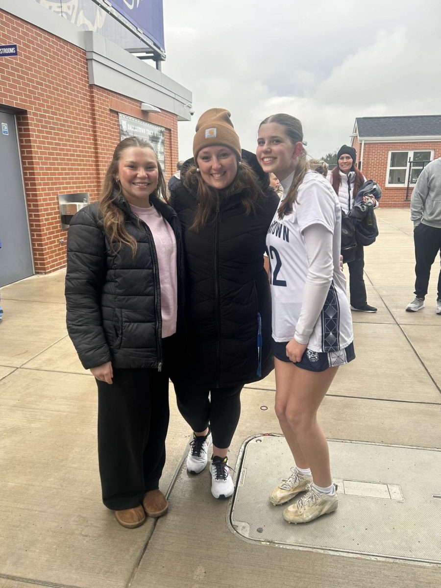 Math teacher Miss Sweitzer (center) poses with students Akira Sorrell (left) and Emily Stock (right) at a girls lacrosse game this spring. Sweitzer is finishing up her first year at DHS where she has also gotten involved with Mini-THON and coaching lacrosse. Photo submitted. 