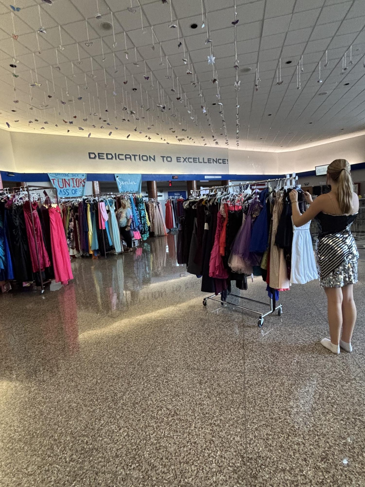 Students from all over York County shop on the Sept. 7 date of the Mini-THON Dress Sale. Shoppers have the opportunity to try on many dresses of various colors, styles, and sizes. (Riley Danielowski)