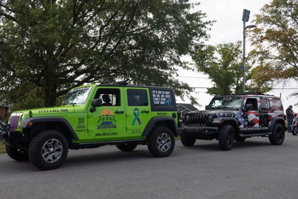 The organization decorates jeeps beforehand for their car show at the event, being able to promote the organization and spread awareness.
