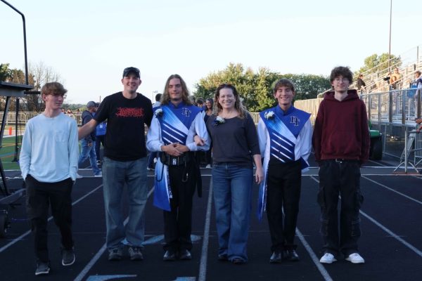All four of the Prelich quads, JD, Gavin, Cody, and Logan pose with their parents while celebrating Gavin and Cody's senior night with the band at the Dallastown Area High School track. Photo Submitted.