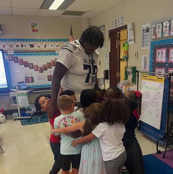 Wydean Roberts is seen participating in Football Friday Readers, where football players from all grades visit elementary schools across Dallastown. 