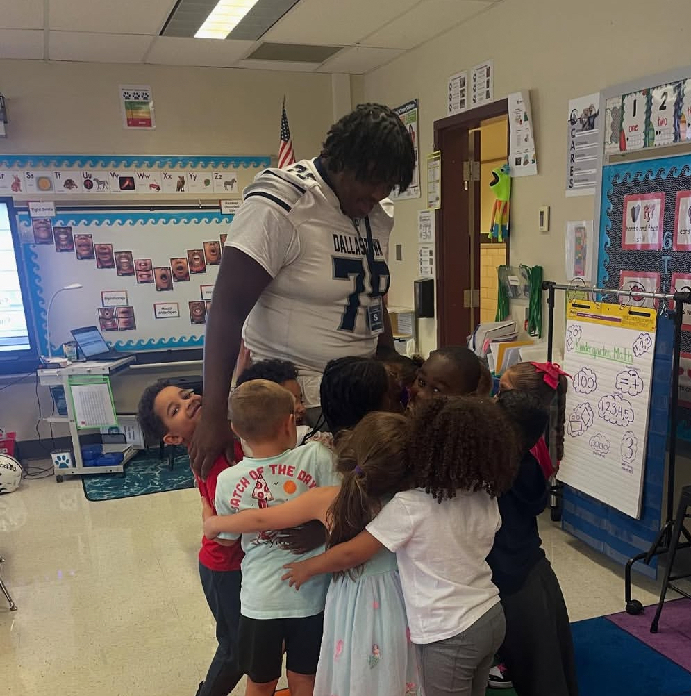 Wydean Roberts is seen participating in Football Friday Readers, where football players from all grades visit elementary schools across Dallastown.