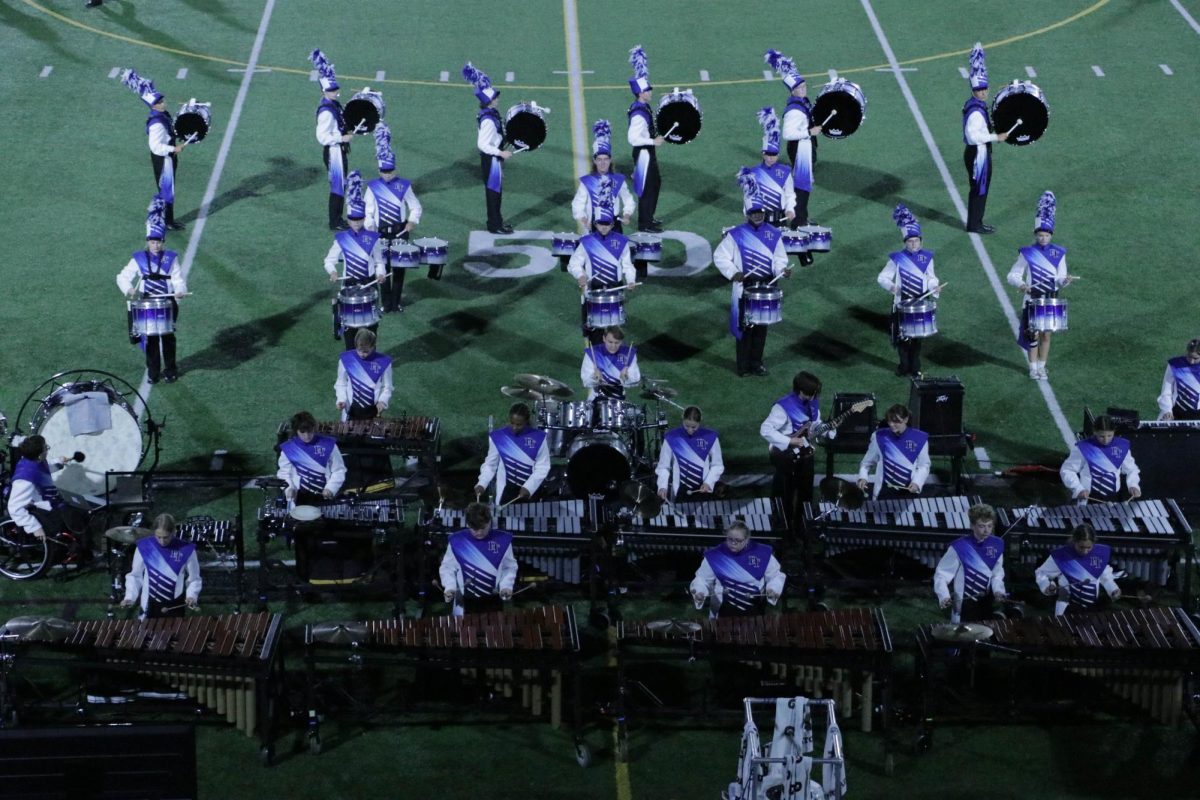 The Dallastown front ensemble and battery performs "Danger Zone" during the percussion feature at halftime against Manheim Central. (Charles Scott)
