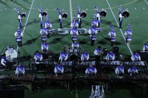 The Dallastown front ensemble and battery performs "Danger Zone" during the percussion feature at halftime against Manheim Central. (Charles Scott)