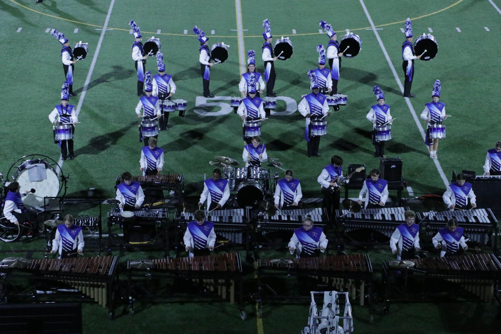 The Dallastown front ensemble and battery performs "Danger Zone" during the percussion feature at halftime against Manheim Central. (Charles Scott)
