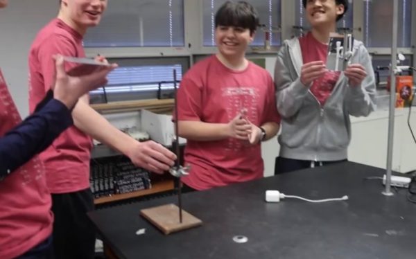 4 students in the process of performing a test.