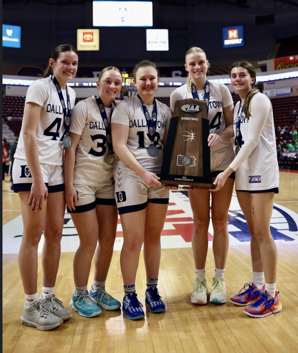 Dallastown Girls’ Basketball Seniors Marleigh Blasser, Abby Lintz, Sophia Scovitch, Ava Jamison, and Olivia Cleaver (left to right) pose at the Giant Center with their PIAA 6A State Runner-Up trophy. (Richard Veytsman)